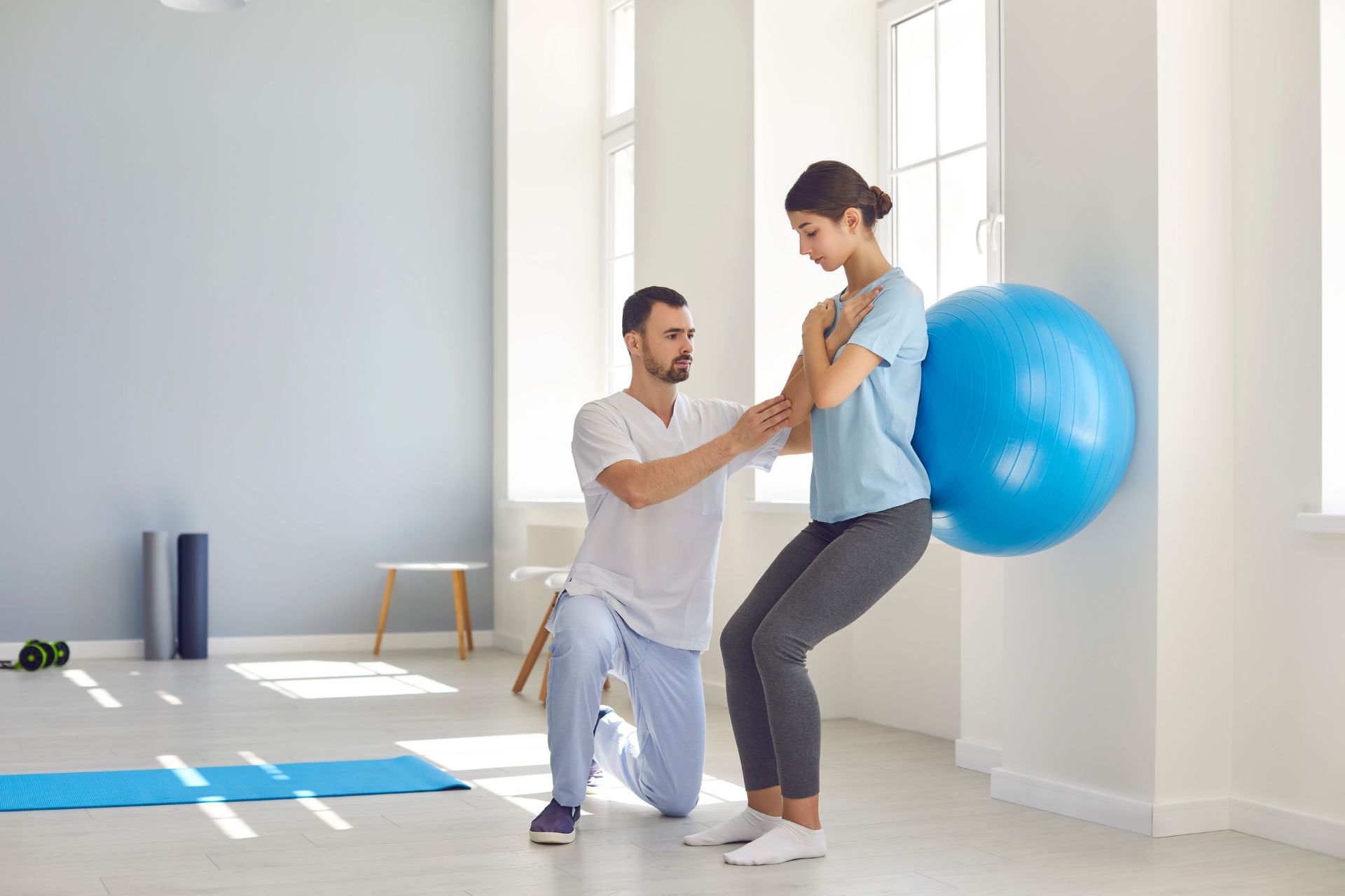 What are the common treatment techniques used in physiotherapy for individuals with back pain?